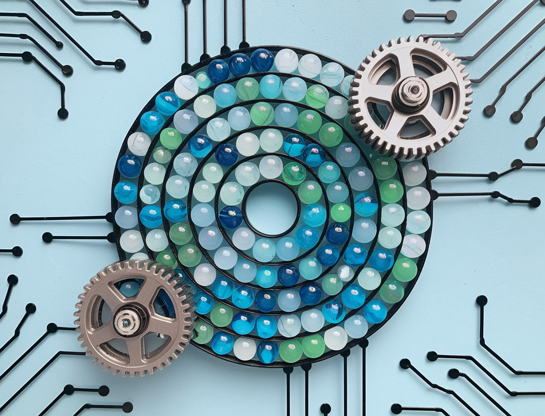 An abstract pic of a playful marble maze with spinning gears and neural network patterns. The marble maze is made of translucent marbles in various shades of blue and green, arranged in a spiral pattern. The spinning gears are made of metal and are placed at the entrance and exit of the maze. The neural network patterns are made of black lines and are placed on the walls of the maze. The background is a light blue wall.